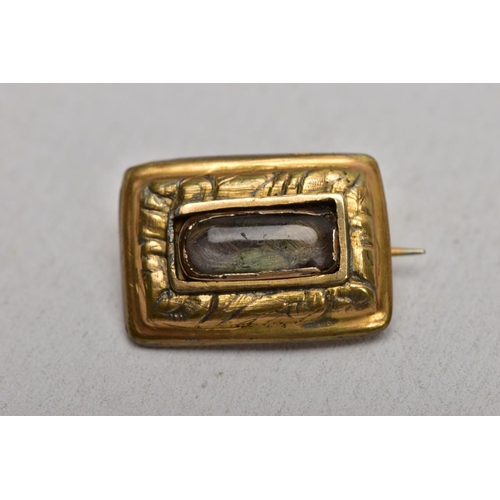 114 - THREE ITEMS OF VICTORIAN JEWELLERY, to include an oval memorial brooch with central double sided swi... 