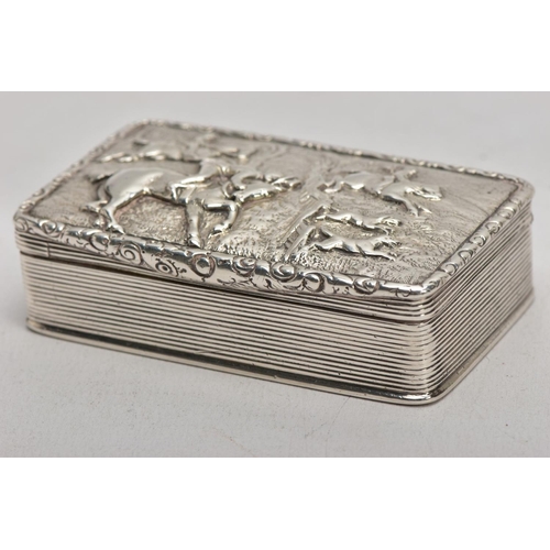 125 - A SILVER TABLE SNUFF BOX, embossed fox hunting scene to the lid, engine turned design to the sides a... 