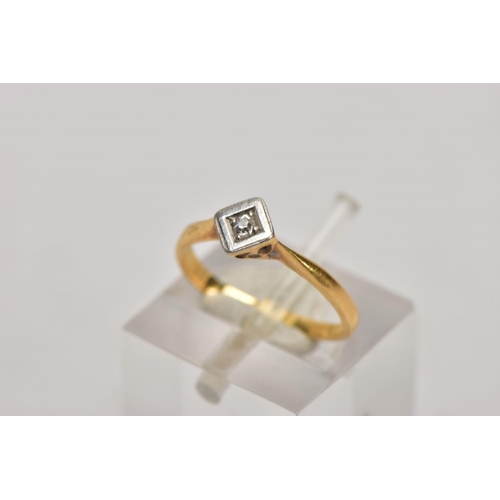 131 - A YELLOW METAL SINGLE STONE DIAMOND RING, misshapen shank, set with a single cut diamond, within a s... 