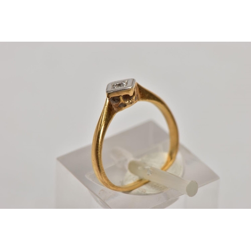 131 - A YELLOW METAL SINGLE STONE DIAMOND RING, misshapen shank, set with a single cut diamond, within a s... 