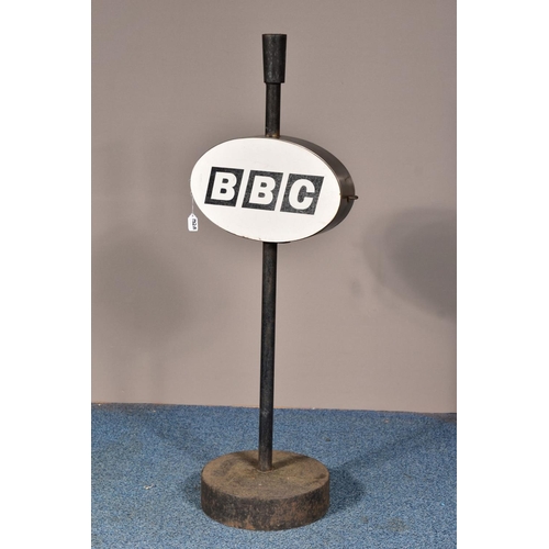 132A - A 'BBC' SIGN, on a cast iron stand and circular base, height 109cm