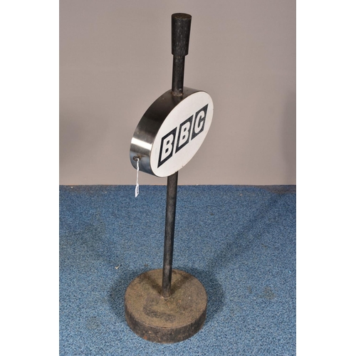 132A - A 'BBC' SIGN, on a cast iron stand and circular base, height 109cm
