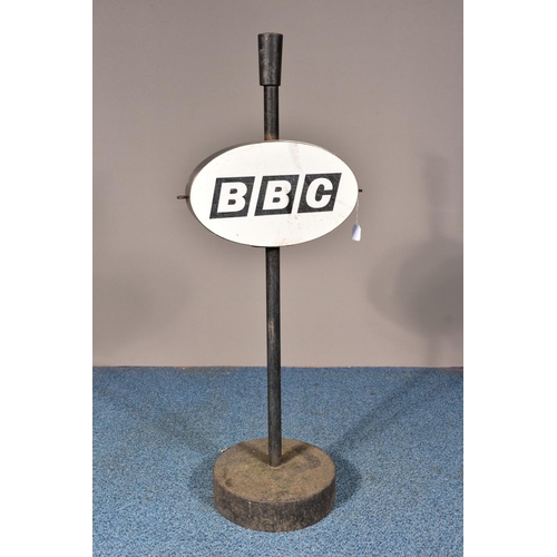 132A - A 'BBC' SIGN, on a cast iron stand and circular base, height 109cm