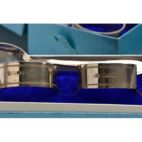 153 - A SINGLE SILVER TEASPOON AND THREE CASED SETS OF NAPKIN RINGS, the teaspoon with a tapered reeded st... 