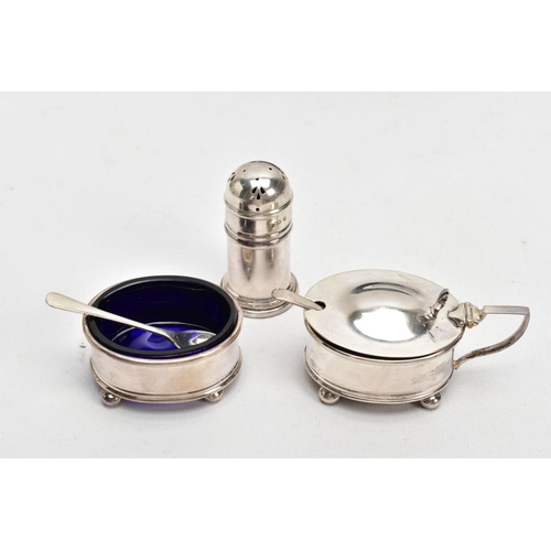 163 - A THREE-PIECE SILVER CONDIMENT SET, comprising of a salt and mustard each with a blue glass lining, ... 