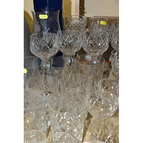 425 - MORE THAN SEVENTY PIECES OF CUT GLASS AND CRYSTAL, including vases, stemware, tumblers and tankards,... 