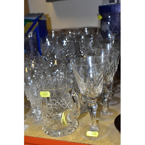 425 - MORE THAN SEVENTY PIECES OF CUT GLASS AND CRYSTAL, including vases, stemware, tumblers and tankards,... 