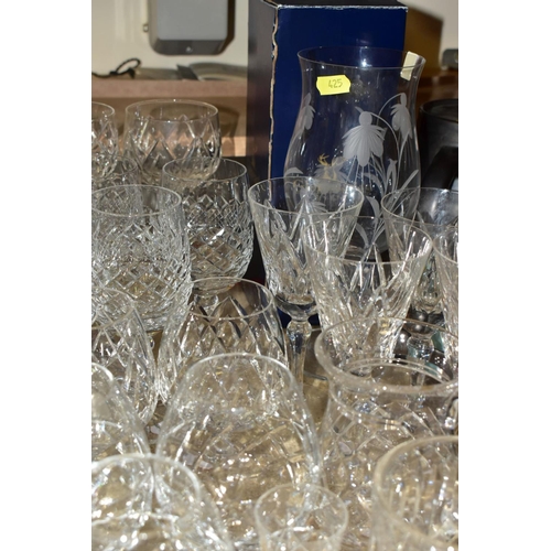 425 - MORE THAN SEVENTY PIECES OF CUT GLASS AND CRYSTAL, including vases, stemware, tumblers and tankards,... 