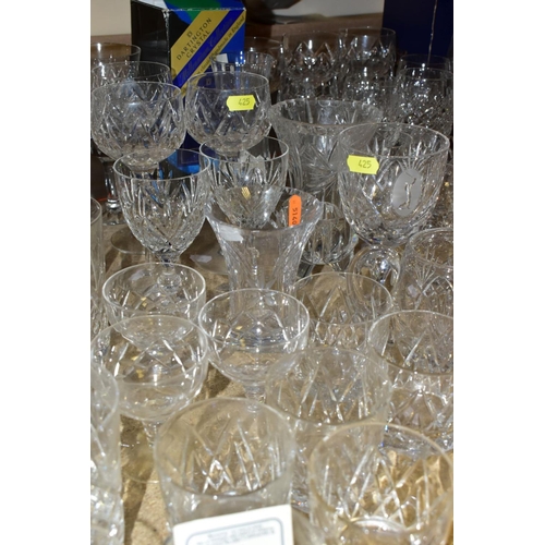 425 - MORE THAN SEVENTY PIECES OF CUT GLASS AND CRYSTAL, including vases, stemware, tumblers and tankards,... 