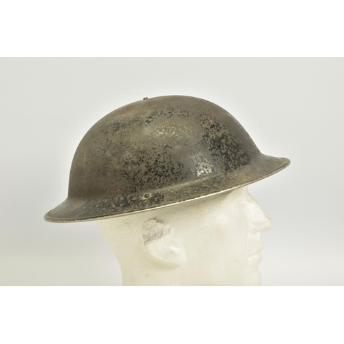 111 - A WWII ERA BRITISH BRODIE STYLE STEEL HELMET, with lining and pads but no chin strap etc, together w... 