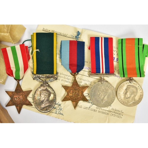 112 - A BOXED GROUP OF WWII MEDALS to include, 1939-45, Italy Stars, Defence & War medal, together with Ge... 