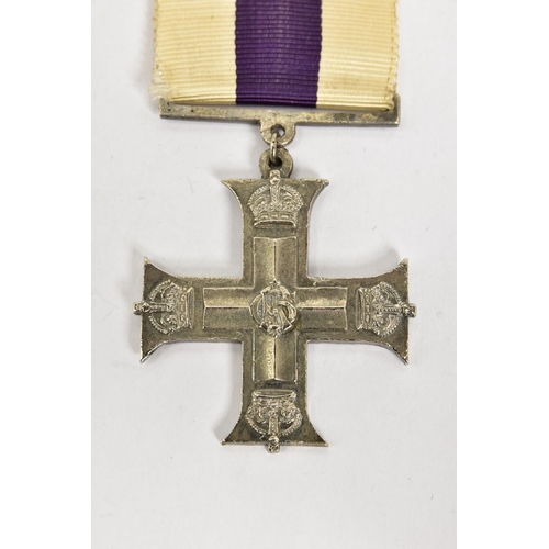 124 - A CAST REPRODUCTION OF A G V MILITARY CROSS (Display piece only)