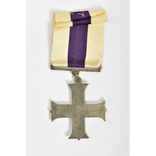 124 - A CAST REPRODUCTION OF A G V MILITARY CROSS (Display piece only)