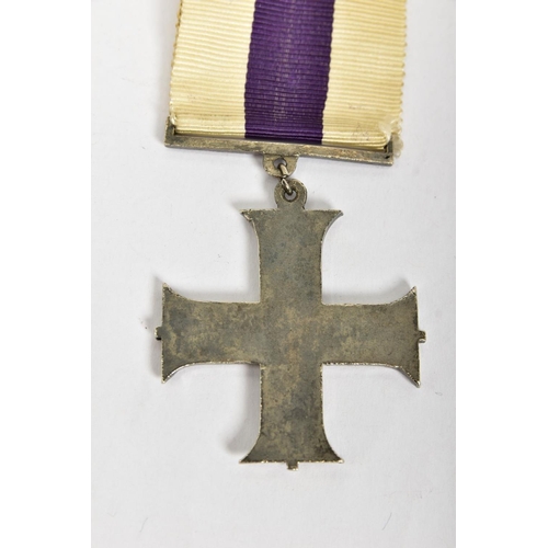 124 - A CAST REPRODUCTION OF A G V MILITARY CROSS (Display piece only)