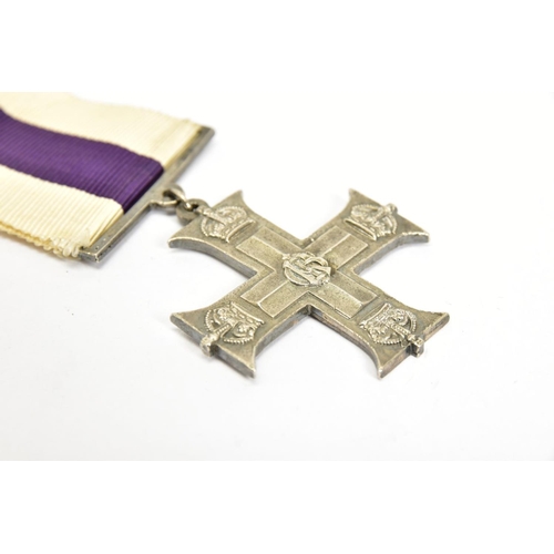 124 - A CAST REPRODUCTION OF A G V MILITARY CROSS (Display piece only)