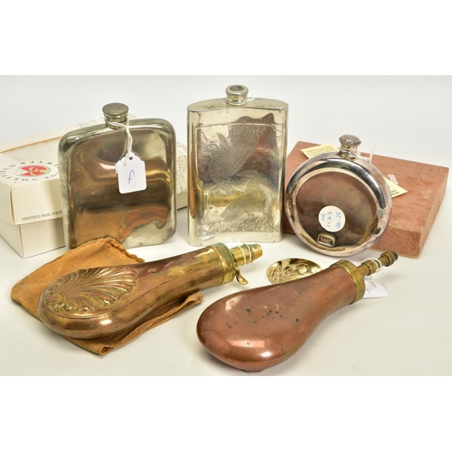 135 - A BOX CONTAINING TWO BLACK POWDER FLASKS, decorated and three drinking hip flasks, two are boxed