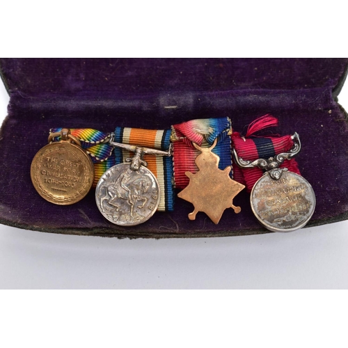 49 - A WW1 ERA METAL FLIP TOP BOX containing a WW1 group of miniature medals to including Distinguished S... 