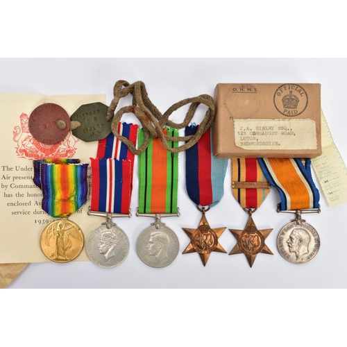 56 - A FAMILY RELATED GROUP OF MEDALS as follows, British War & Victory Medal pair named S4-217831 Pte H.... 