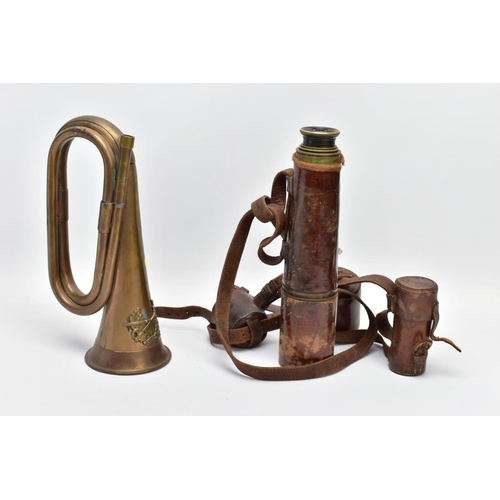 62 - A MILITARY STYLE BUGLE, no mouthpiece wreath & crossed swords design applied, together with an Ottwa... 