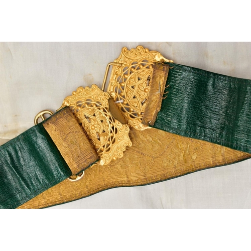 64 - A BOXED LADIES ? MILITARY STYLE STABLE BELT, with a very ornate gilded two part buckle with silver S... 