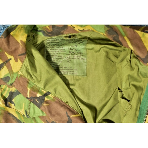 76 - A NUMBER OF CAMOFLOUGE MILITARY UNIFORM ITEMS to includ, British Combat Smock liner size 4 sleeveles... 