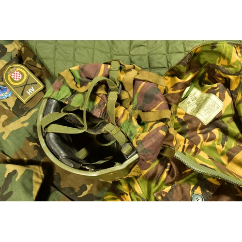 76 - A NUMBER OF CAMOFLOUGE MILITARY UNIFORM ITEMS to includ, British Combat Smock liner size 4 sleeveles... 