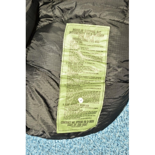 78 - A BLACK MILITARY STYLE MODULAR COLD WEATHER SLEEPING BAG contained in a drab olive Military Grip bag