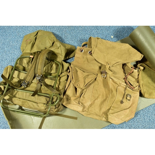 79 - A BOX CONTAINING THREE MILITARY BAGS, one being a back pack with metal frame, and a length of padded... 