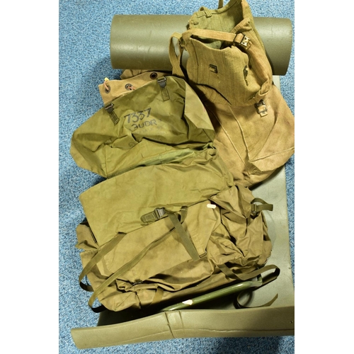 79 - A BOX CONTAINING THREE MILITARY BAGS, one being a back pack with metal frame, and a length of padded... 