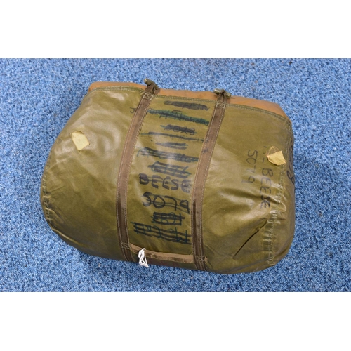 86 - A MILITARY ROLL-OUT SLEEPING BAG contained in its own cover