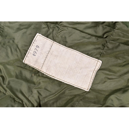 86 - A MILITARY ROLL-OUT SLEEPING BAG contained in its own cover