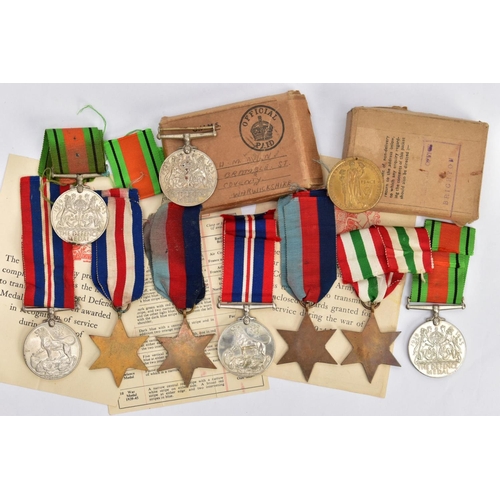 94 - A BOXED GROUP OF FOUR WWII MEDALS to include 1939-45, Italy Stars, Defence & War medal with award sl... 