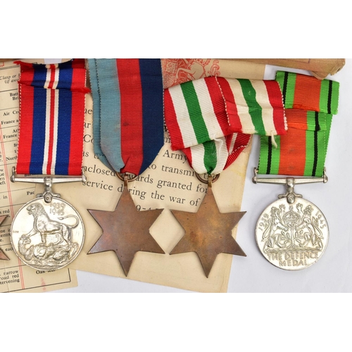 94 - A BOXED GROUP OF FOUR WWII MEDALS to include 1939-45, Italy Stars, Defence & War medal with award sl... 