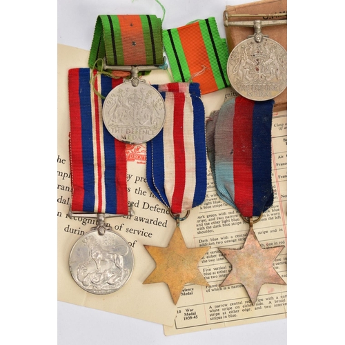 94 - A BOXED GROUP OF FOUR WWII MEDALS to include 1939-45, Italy Stars, Defence & War medal with award sl... 