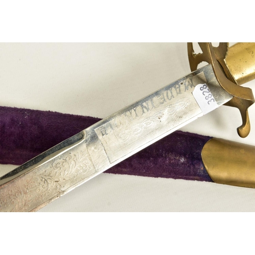 95 - AN INDIAN MADE CURVED SWORD, in a wooden scabbard trimmed with purple coloured velvet style cloth wi... 