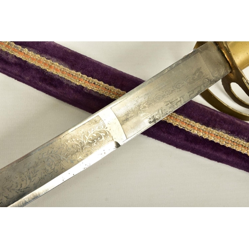 95 - AN INDIAN MADE CURVED SWORD, in a wooden scabbard trimmed with purple coloured velvet style cloth wi... 