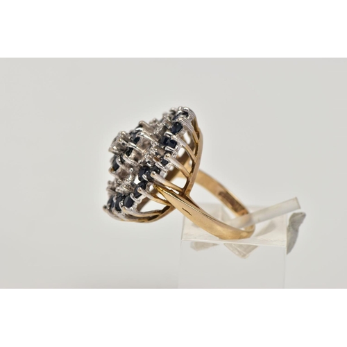 156 - A 9CT GOLD SAPPHIRE AND DIAMOND CLUSTER RING, the tiered cluster claw set with circular blue sapphir... 