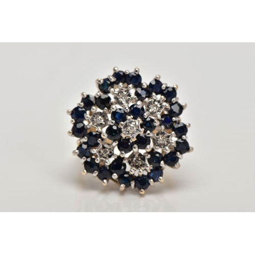 156 - A 9CT GOLD SAPPHIRE AND DIAMOND CLUSTER RING, the tiered cluster claw set with circular blue sapphir... 