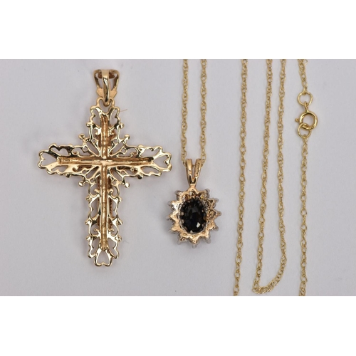 161 - TWO 9CT GOLD GEM SET PENDANTS, the first designed as a diamond set cross with outer scalloped detail... 