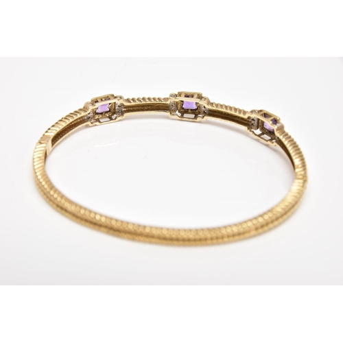 164 - A 9CT GOLD AMETHYST AND DIAMOND HINGED BANGLE, the bangle with a twist pattern, set with three squar... 