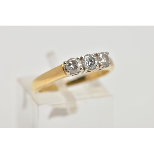 202 - AN 18CT THREE STONE DIAMOND RING, designed as three brilliant cut diamonds within claw settings to t... 