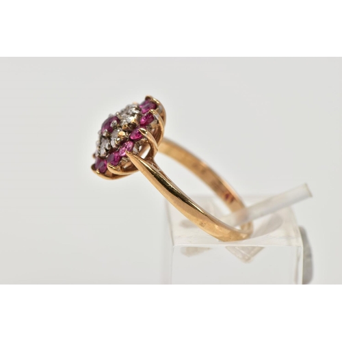 203 - A 9CT GOLD RUBY AND DIAMOND CLUSTER RING, designed as a tiered cluster of circular cut rubies and br... 