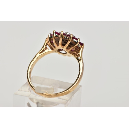 203 - A 9CT GOLD RUBY AND DIAMOND CLUSTER RING, designed as a tiered cluster of circular cut rubies and br... 