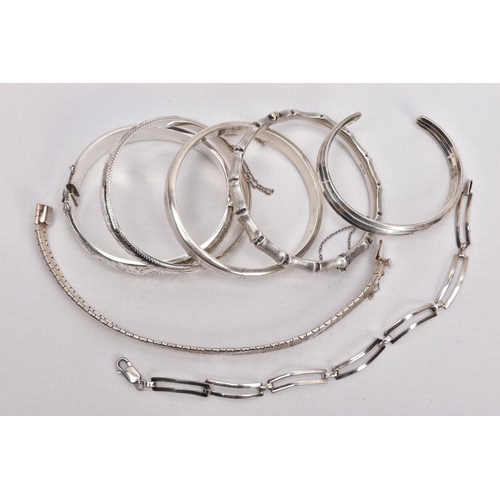 212 - A PARCEL OF SILVER AND WHITE METAL BANGLES AND BRACELETS, to include a wide silver hinged bangle, de... 