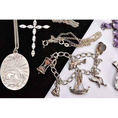 215 - A SELECTION OF SILVER AND WHITE METAL JEWELLERY, to include a silver oval pendant, engraved with the... 