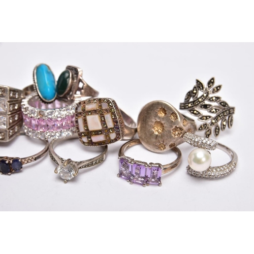 220 - A SELECTION OF SILVER AND WHITE METAL RINGS, to include a foliate marcasite ring, a signet style rin... 