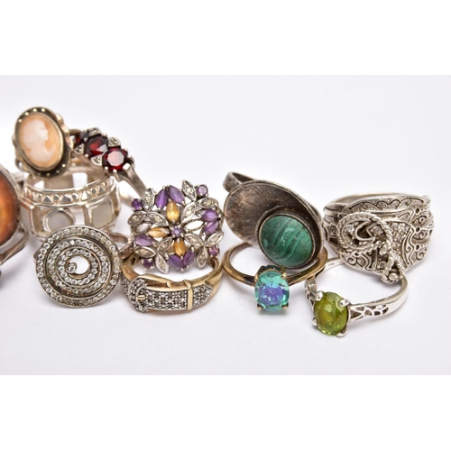 221 - A SELECTION OF THIRTEEN SILVER AND WHITE METAL RINGS, to include an operculum shell ring, a malachit... 