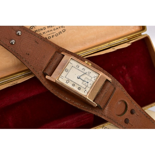 222 - A VINTAGE WRISTWATCH, the rectangular head with black Arabic numerals, a subsidiary seconds dial to ... 