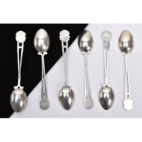 229 - SIX SILVER TEASPOONS, each handle designed as two back to back golf clubs and golf ball with shield ... 