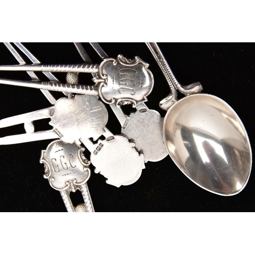 229 - SIX SILVER TEASPOONS, each handle designed as two back to back golf clubs and golf ball with shield ... 